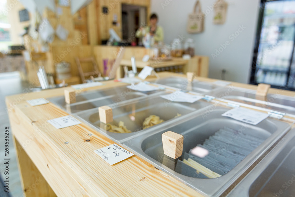 Different organic pasta in metal bowls ready for bulk shopping in zero waste store. Different organic pasta in metal bowls ready for bulk shopping in zero waste store.