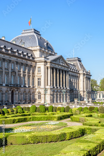 Three-quarter view of the colonnade and formal garden of the Royal Palace of Brussels, the official palace of the King and Queen of the Belgians in the historic center of Brussels, Belgium.