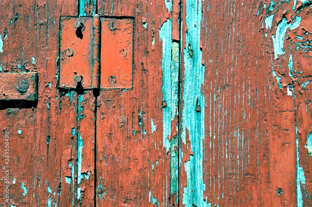 background of a piece of old wooden shutters with cracked red paint background of a piece of old wooden shutters with cracked red paint