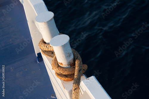 rope wrapped around two poles a boat