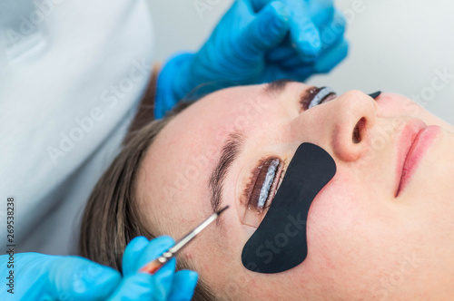 Eyelash lamination procedure. Staining  curling  laminating  lash lift. Eyelash Extension. Lengthening lashes for girl in beauty salon. Beauty Concept.