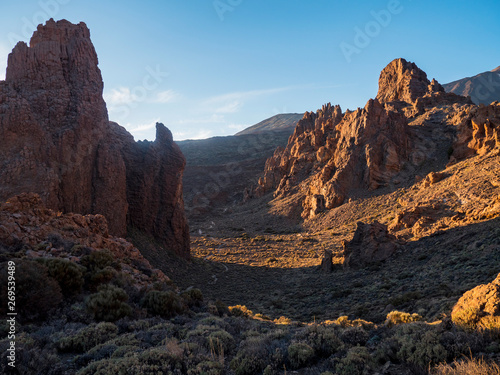 A spot in Tenerife with many rocks and a beautiful mountain landscape in the background