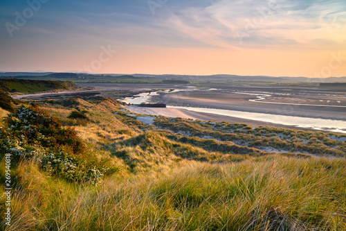 Mud Flats and Dunes at Budle Bay,  at low tide are part of Lindisfarne Nature reserve on Northumberland's AONB coastline photo