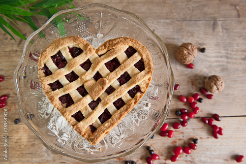 Cheery pie with heart shapes. Woman decoration homemade  cake.