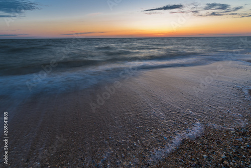 photo on long exposure  waves at sea at sunset