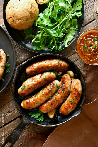 Fried sausages in frying pan