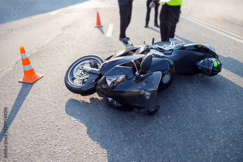 broken motorcycle on the road accident site