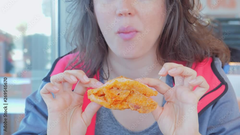 Woman eating tasty delicacy meat sandwich with appetite. Portuguese cuisine Woman eating tasty delicacy meat sandwich with appetite. Portuguese cuisine