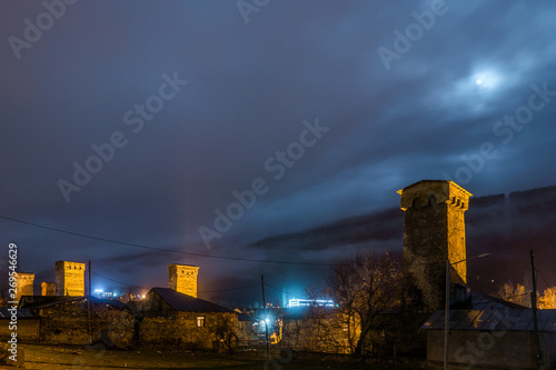 nightscene in mestia fog rising over defensive towers