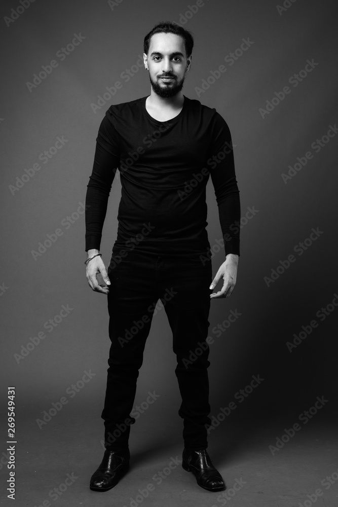 Young bearded Indian man in black and white Young bearded Indian man in black and white