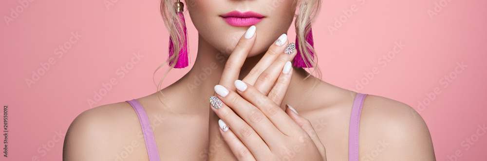 Beauty Woman with perfect Makeup and Manicure. Glamour Girl with Jewelry. Pink Lips and Nails. Precious Stones and Silver. Beauty girls Face isolated on light Background. Fashion photo - obrazy, fototapety, plakaty 