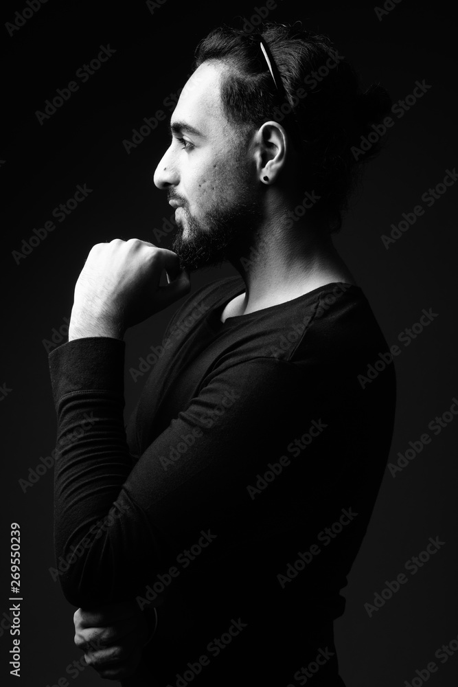 Young bearded Indian man in black and white Young bearded Indian man in black and white