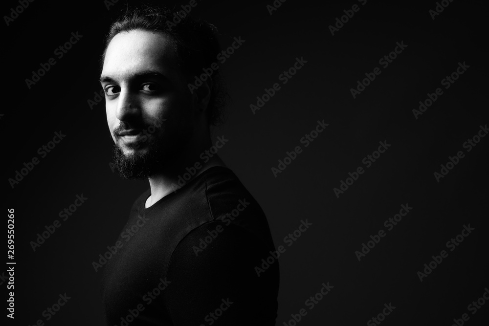 Young bearded Indian man in black and white Young bearded Indian man in black and white