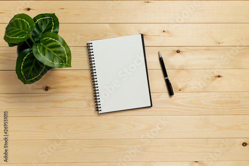 empty notebook on wooden table ,top view