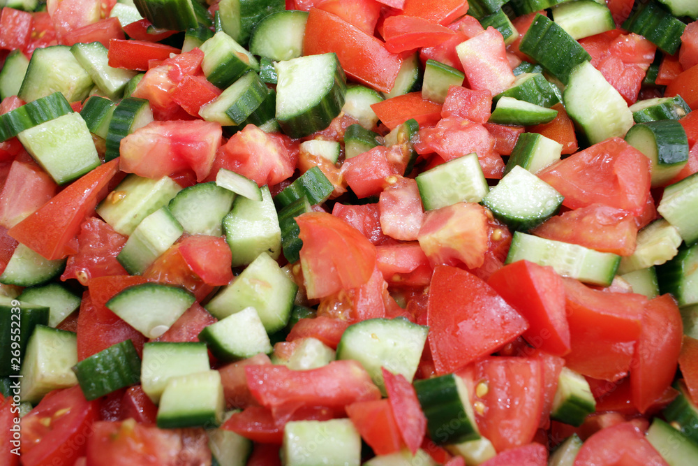 Tomato and cucumber salad with olive oil. Vegan salad. Vegetarian food. Healthy eating concept. Vegetables background texture. Full frame cover photo. Detox. Tomato and cucumber salad with olive oil. Vegan salad. Vegetarian food. Healthy eating concept. Vegetables background texture. Full frame cover photo. Detox.