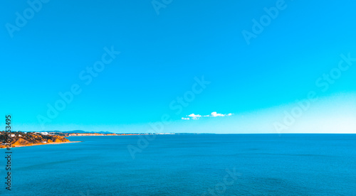 Fototapeta Naklejka Na Ścianę i Meble -  big panoramic overview at coastline with ocean and copy space in the sky