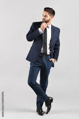 Fashionable young man on gr...