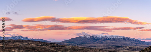 Colorful and vibrant sunset against snowcapped mountains