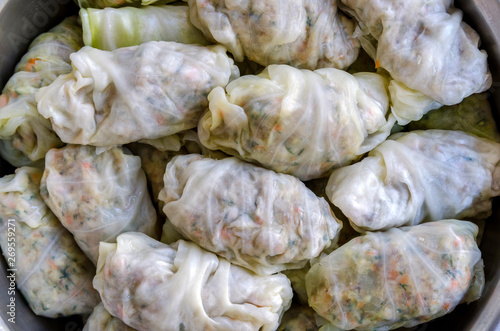 Close-up shot of Cabbage Rolls or Dolma. Stuffed cabbage leaves with minced meat, rice, vegetables and herbs. Sarma, golubtsy, dolmades or golabki. Top view