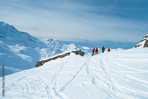 Skiers off piste in alpine ski resort