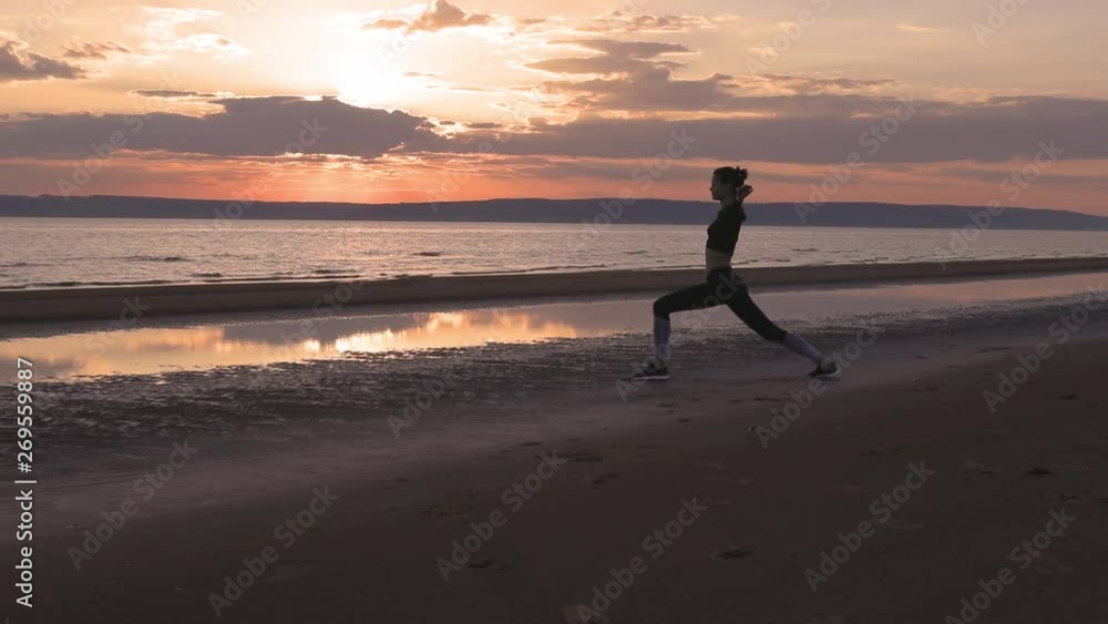 Fitness woman doing exercise on the beach Fitness woman doing exercise on the beach
