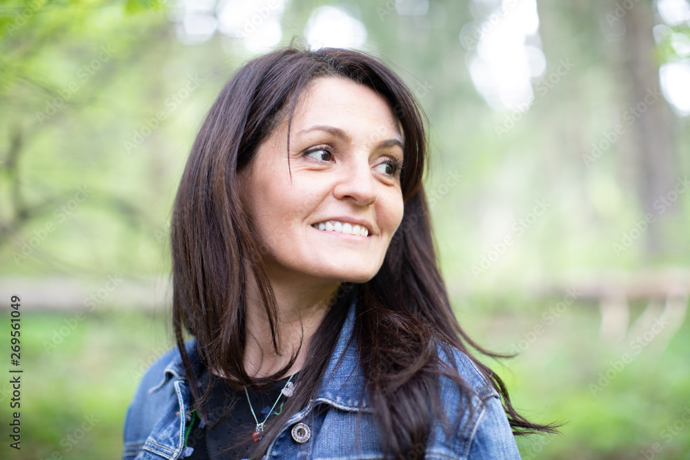 nice mature woman walking in the forest nice mature woman walking in the forest