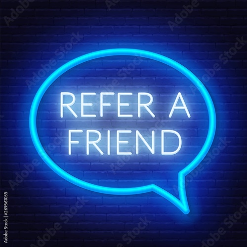 Refer a friend neon sign in a speech bubble frame on a brick wall background. Template for referral program .