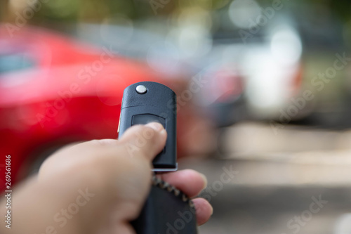 Business woman presses a button on the car remote control key against blur car modern lifestyle concept © Kamonrat