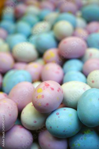 Small colorful chocolate eggs in hard sugar shell in bulk for Easter