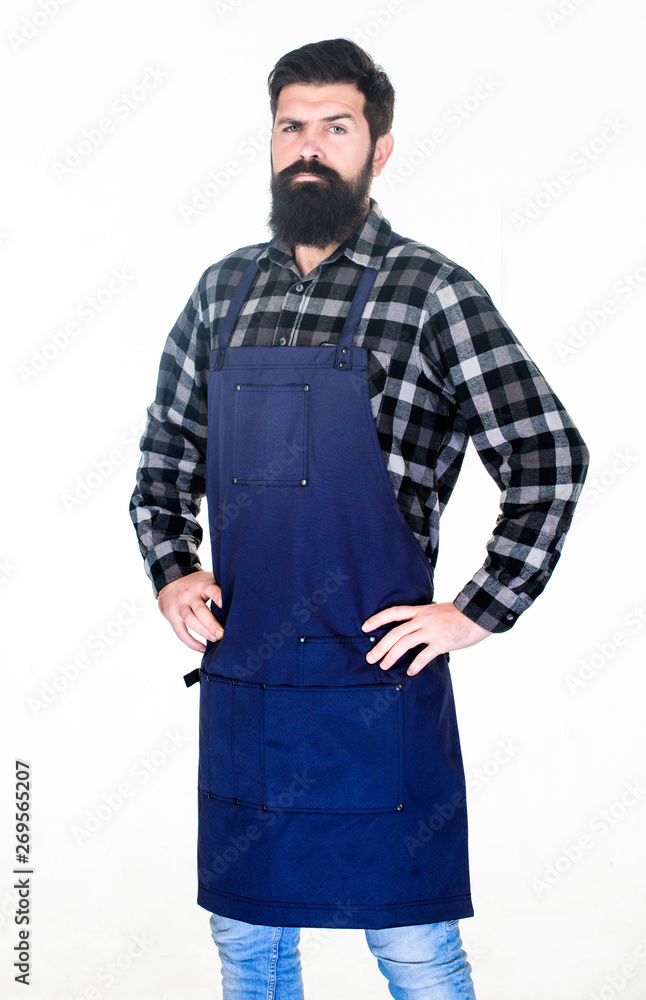 Serving at a hairdressers. Barber isolated on white. Bearded man wearing barber apron. Hipster in work apron with multiple pockets. Hair stylist in barber shop. Barbershop or hairdressing salon Serving at a hairdressers. Barber isolated on white. Bearded man wearing barber apron. Hipster in work apron with multiple pockets. Hair stylist in barber shop. Barbershop or hairdressing salon