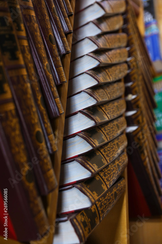 Fototapeta Naklejka Na Ścianę i Meble -  Wooden cabinet with collection of books in library, closeup