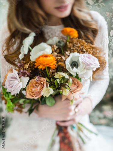 nice young bride with flowers