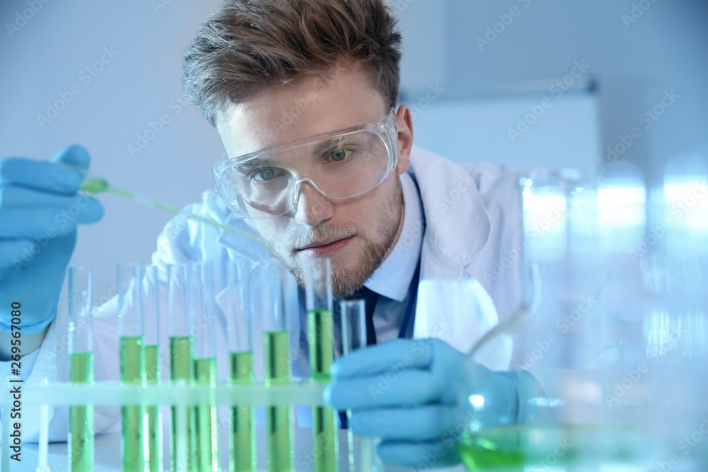 Male scientist working with sample in chemistry laboratory Male scientist working with sample in chemistry laboratory