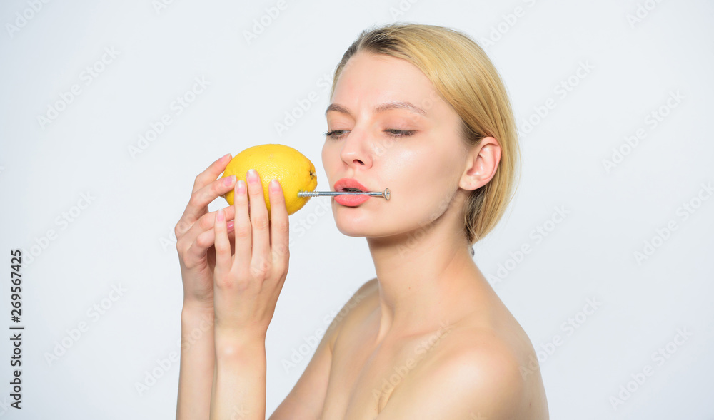 Lemon with hobnail natural battery. girl with lemon charging. Recharge your body vitamins. lemon battery. girl with hobnail at lemon. vitamin diet food. healthy skin. energy and positive mood Lemon with hobnail natural battery. girl with lemon charging. Recharge your body vitamins. lemon battery. girl with hobnail at lemon. vitamin diet food. healthy skin. energy and positive mood
