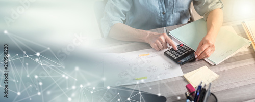 Photography Female accountant using calculator; multiple exposure