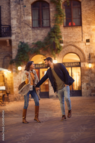 Young couple in love flirting while enjoying on Italy .