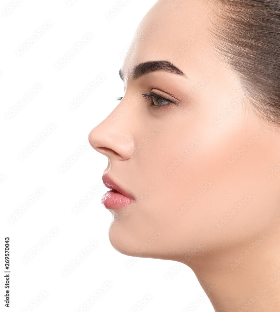 Portrait of young woman with beautiful face and natural makeup on white background, closeup Portrait of young woman with beautiful face and natural makeup on white background, closeup