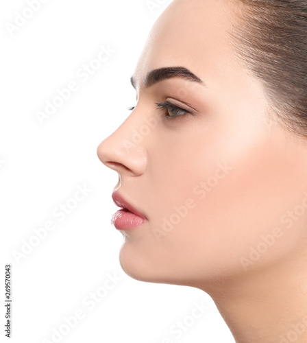 Portrait of young woman with beautiful face and natural makeup on white background  closeup