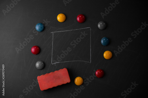 Round Flat shape stones with one eraser stick to old chalk black board