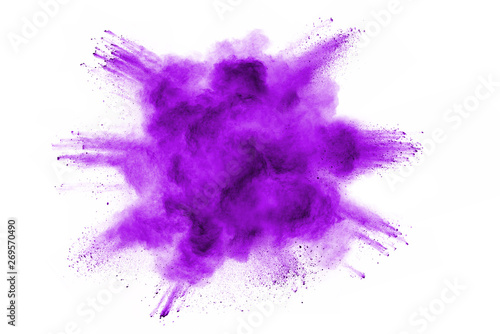 Freeze motion of purple color powder exploding on white background.