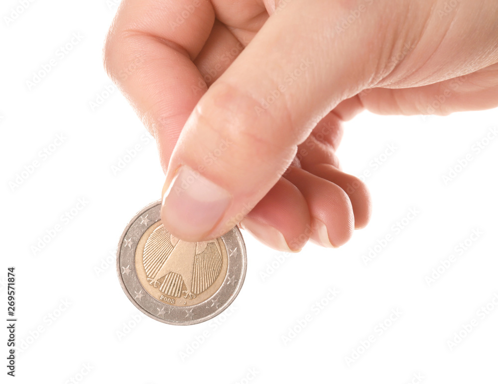 Woman holding coin in hand on white background, closeup Woman holding coin in hand on white background, closeup