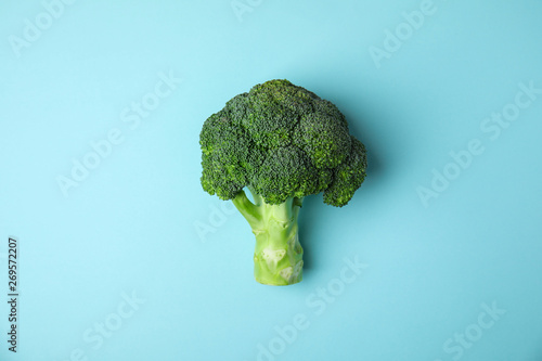 Fresh green broccoli on color background, top view. Organic food photo