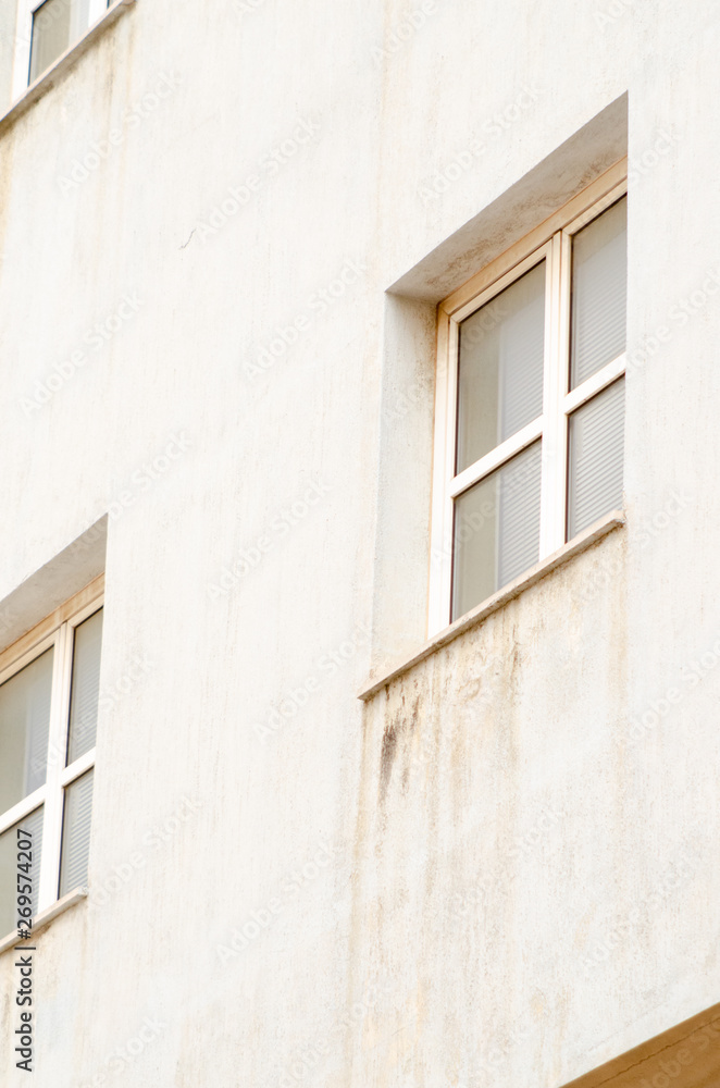 Fototapeta premium Unhealthy mold damaged walls, out house window