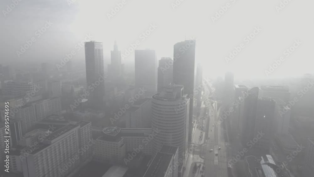 Aerial view of the financial district in Warsaw / Poland. Modern skyscrapers in the fog at sunrise. Taken from a drone in 4K Aerial view of the financial district in Warsaw / Poland. Modern skyscrapers in the fog at sunrise. Taken from a drone in 4K