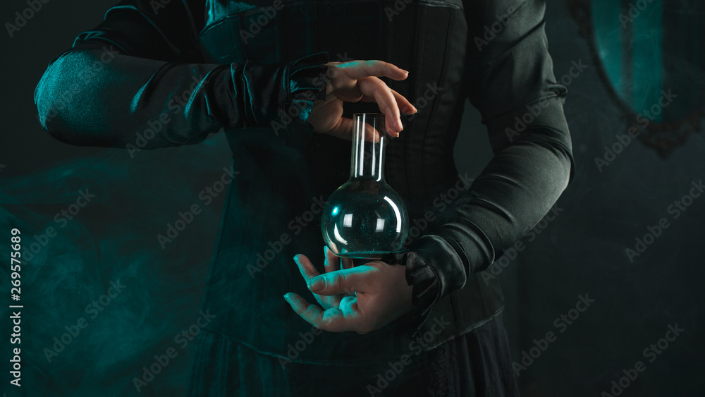 woman is a research scientist holding a flask with the material. Concept of scientific research and history of science.
