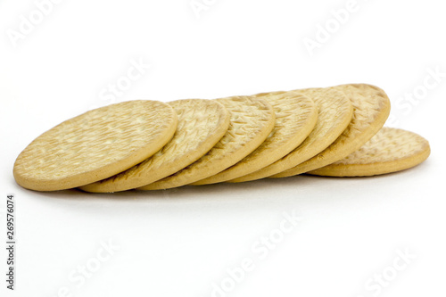 Tasty golden cookies closeup..Seven round cookies on a white background.