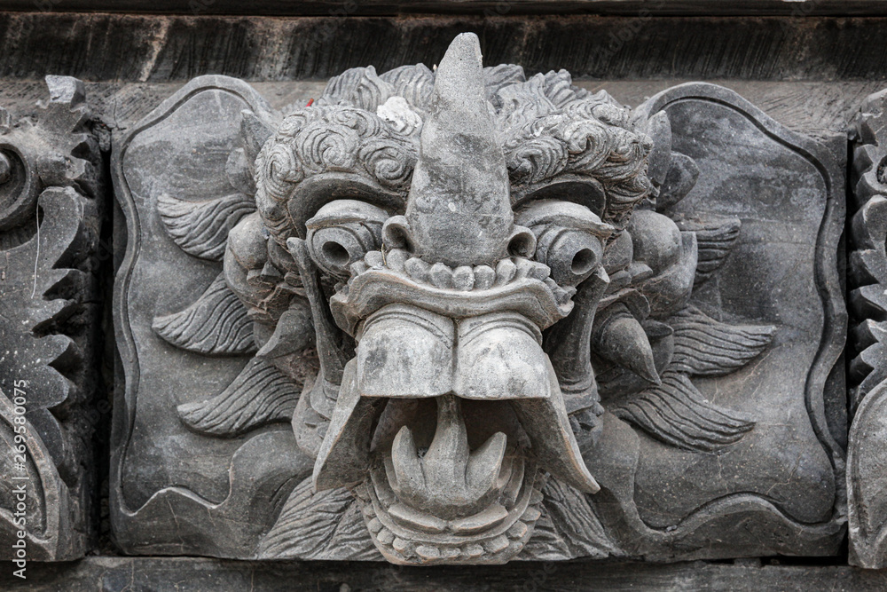 Stone face sculpture in wall at Bali Indonesia Stone face sculpture in wall at Bali Indonesia