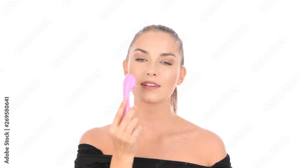 Beauty concept. The woman is massage the face with the machine. Beauty concept. The woman is massage the face with the machine.