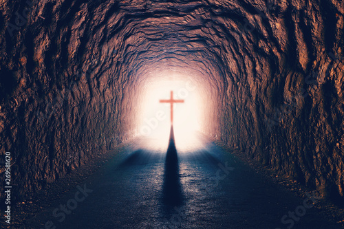 Ciencia y religión cristiana.Cruz de Jesucristo y concepto de resurrección.Tunel hacia la muerte y salvación photo