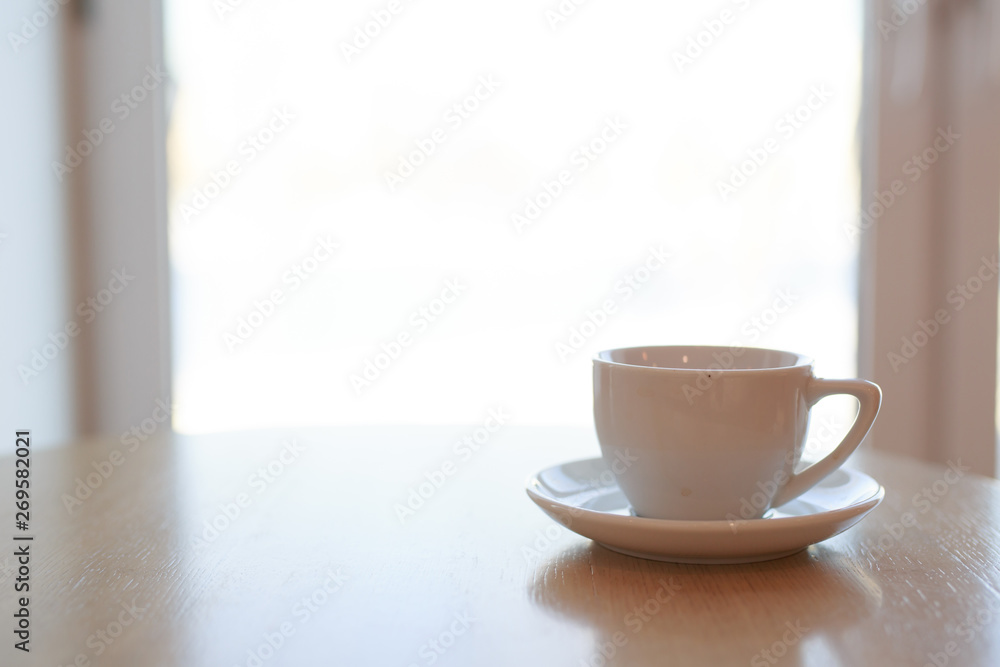 wooden table white Cup and saucer side view wooden table white Cup and saucer side view